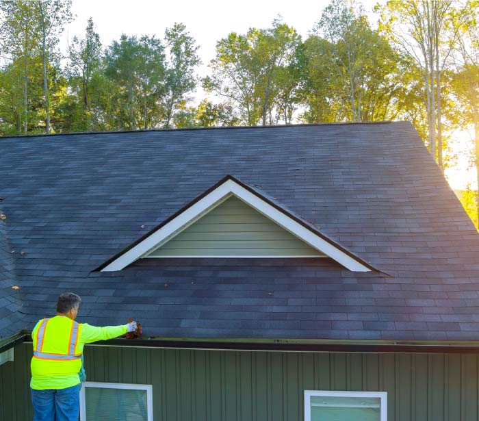 roofer from one way company performing gutters maintenance in hemet, ca
